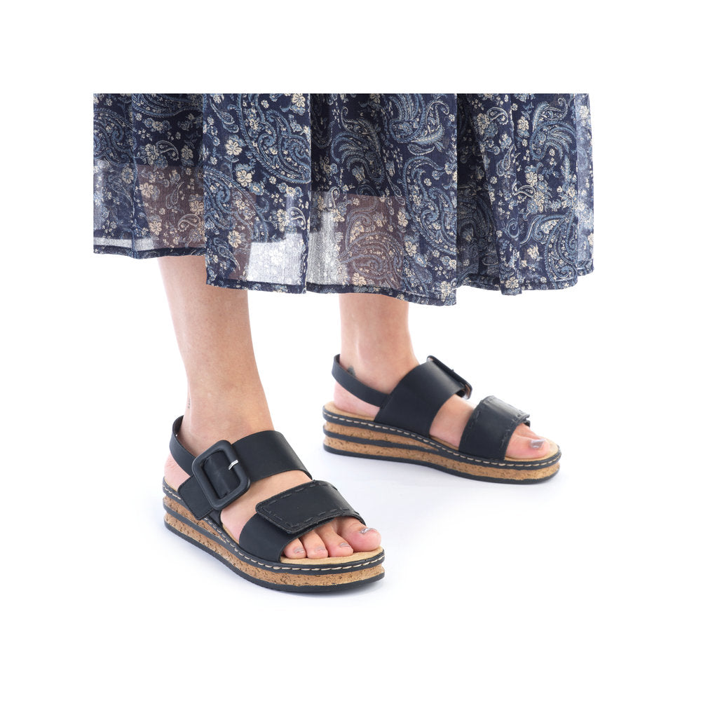 Rieker 62950 Ladies Sandals The Rieker 62950 Ladies Stylish Slingback Sandals In Black or White Have A Wedge Heel & Buckle Detail. Colours Ltd, Colours, Colours Farnham, Colours Shoes